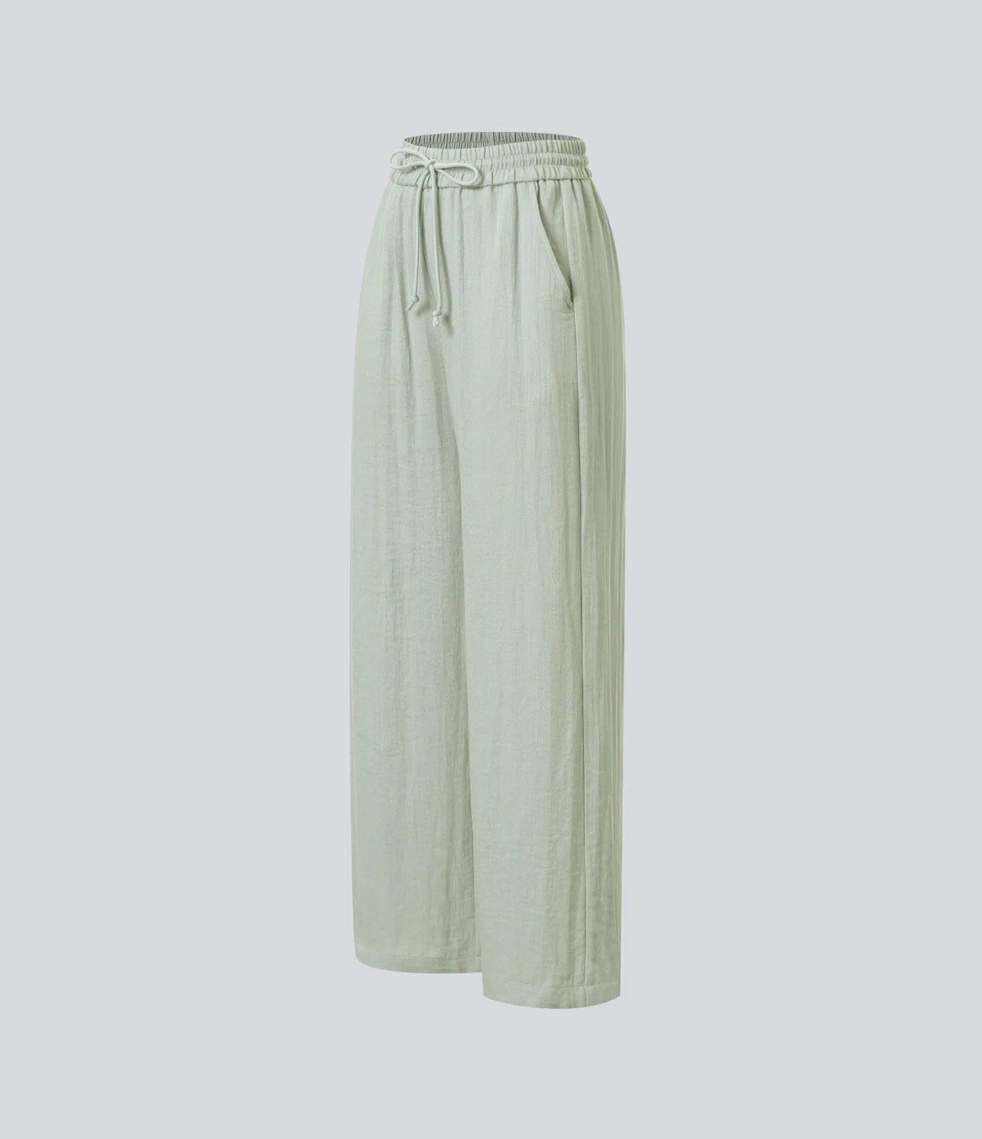 Casual pants with a linen-like feel, high waist, side drawstring, and wide-leg cut.