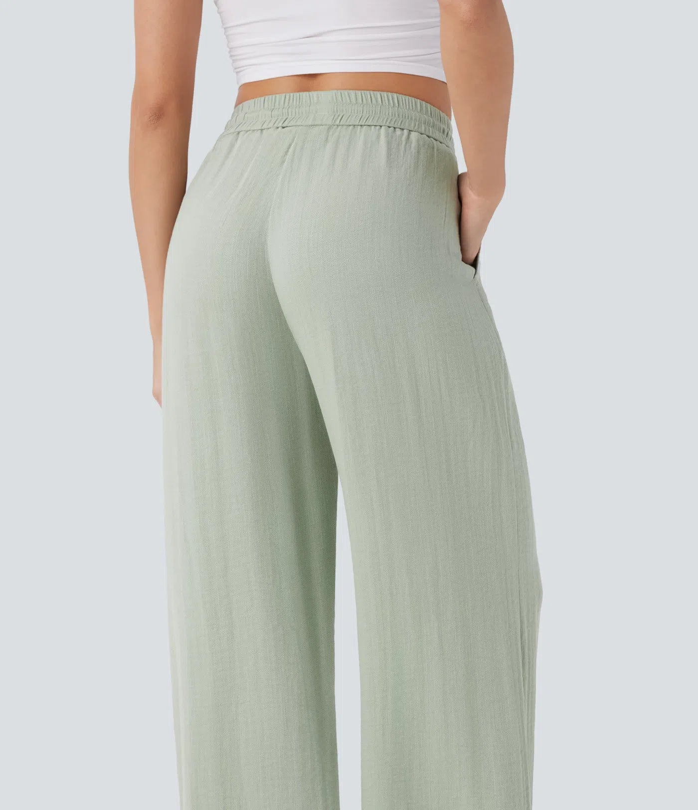 “Casual pants with a linen feel, high waist, side drawstring, and wide legs.”