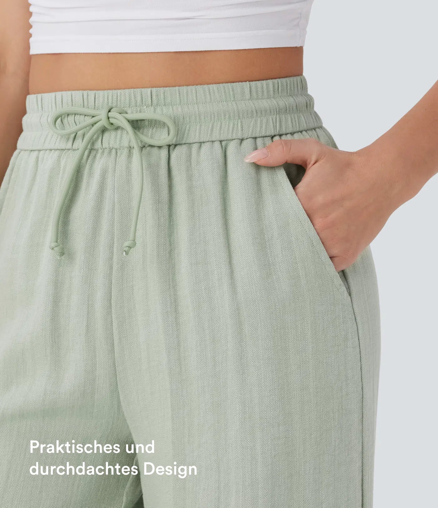 Casual pants with a linen-like feel, high waist, side drawstring, and wide-leg cut.