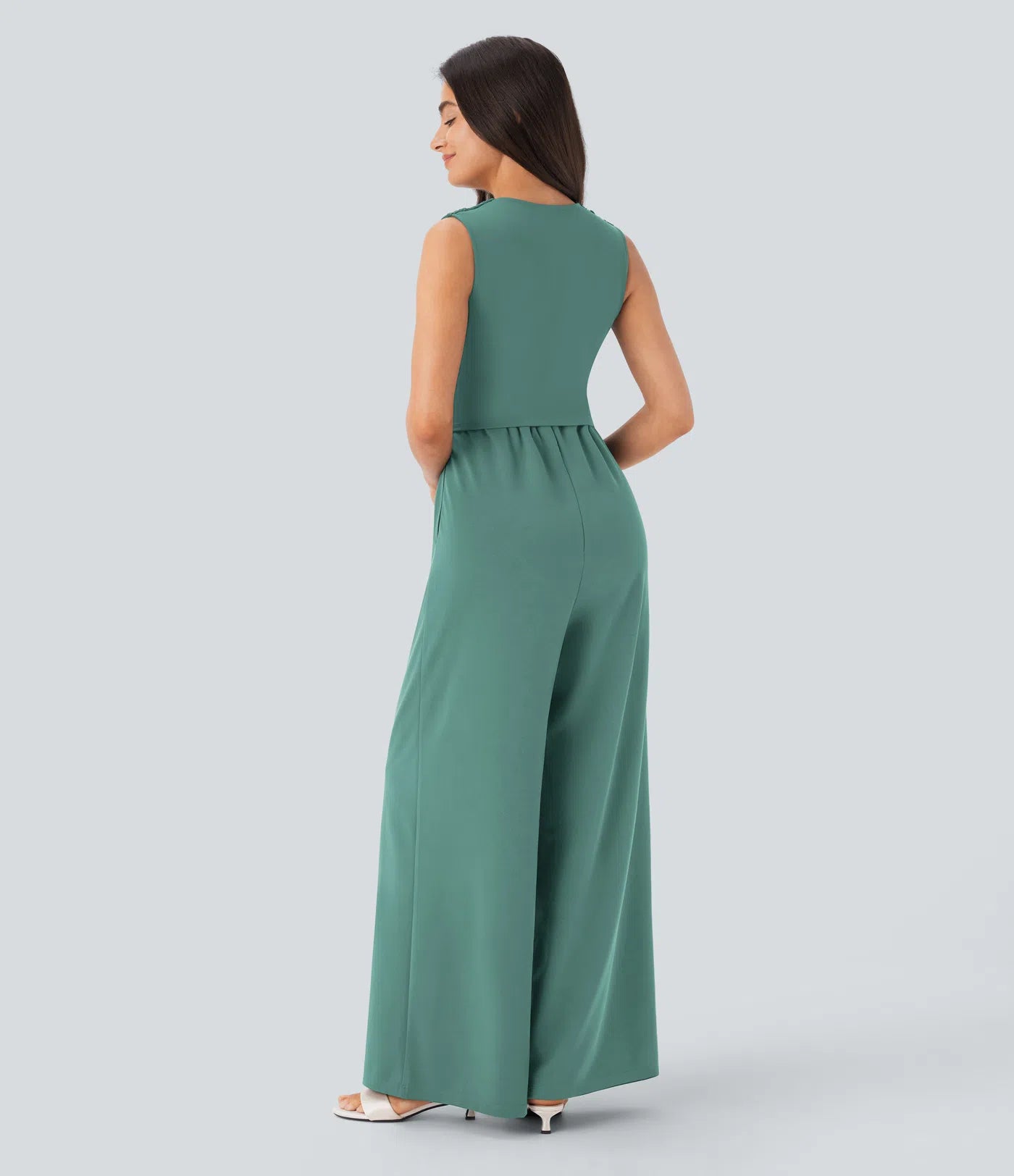 Sleeveless, ruched party jumpsuit with a flattering V-neckline, practical side pockets, and a discreet invisible zipper – stylish and totally bathroom-friendly