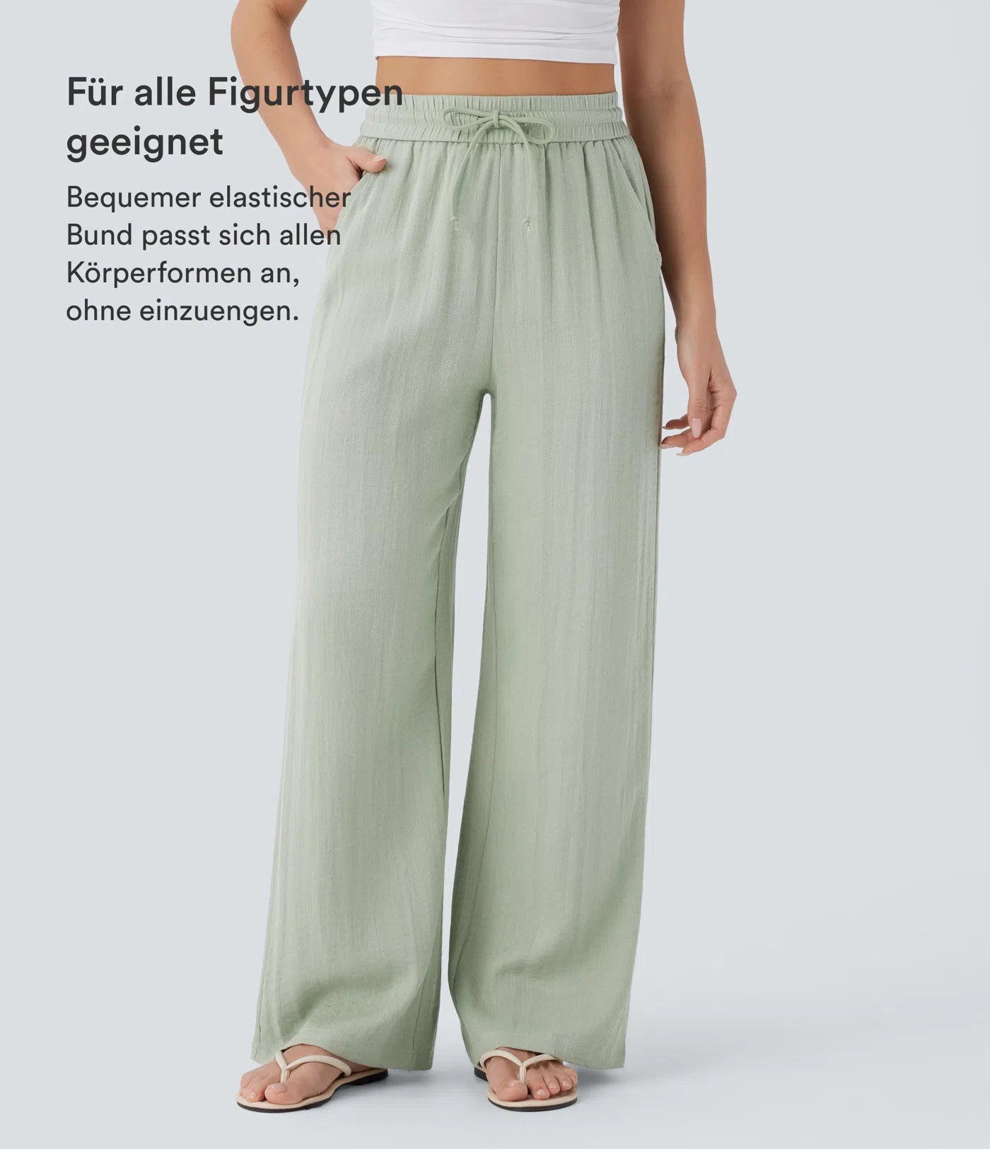 Casual pants with a linen-like feel, high waist, side drawstring, and wide-leg cut.